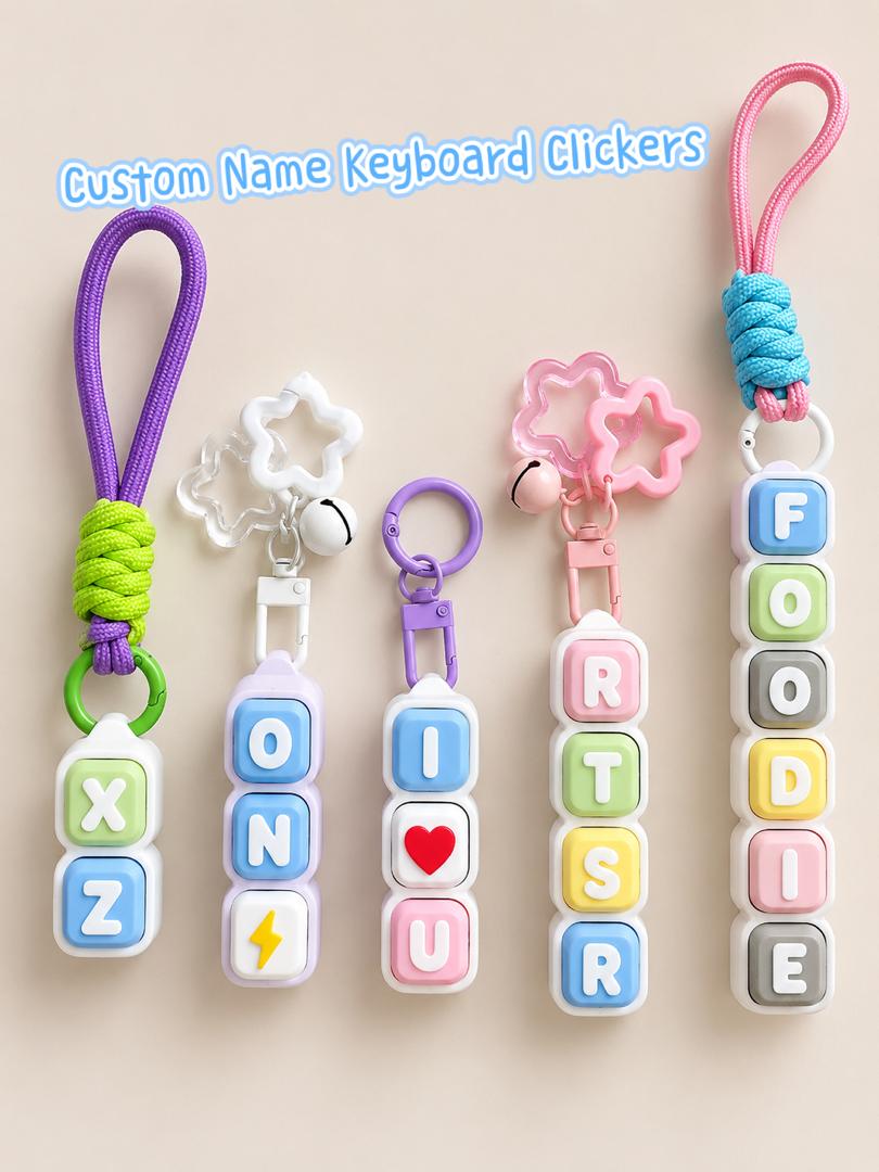 Custom name keyboard letter clickers spelling names, attached to a stars-and-bell keychain and a braided lanyard
