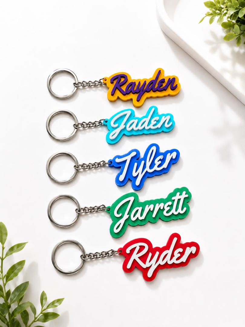 Personalized name keychains in cursive lettering, custom colors